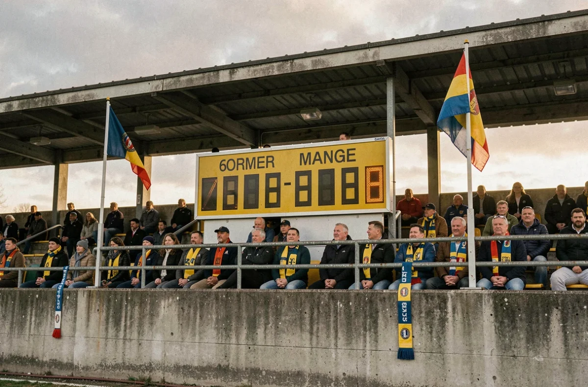Tableau de score électronique d'un stade de rugby Nationale 2 avec supporters en tribune